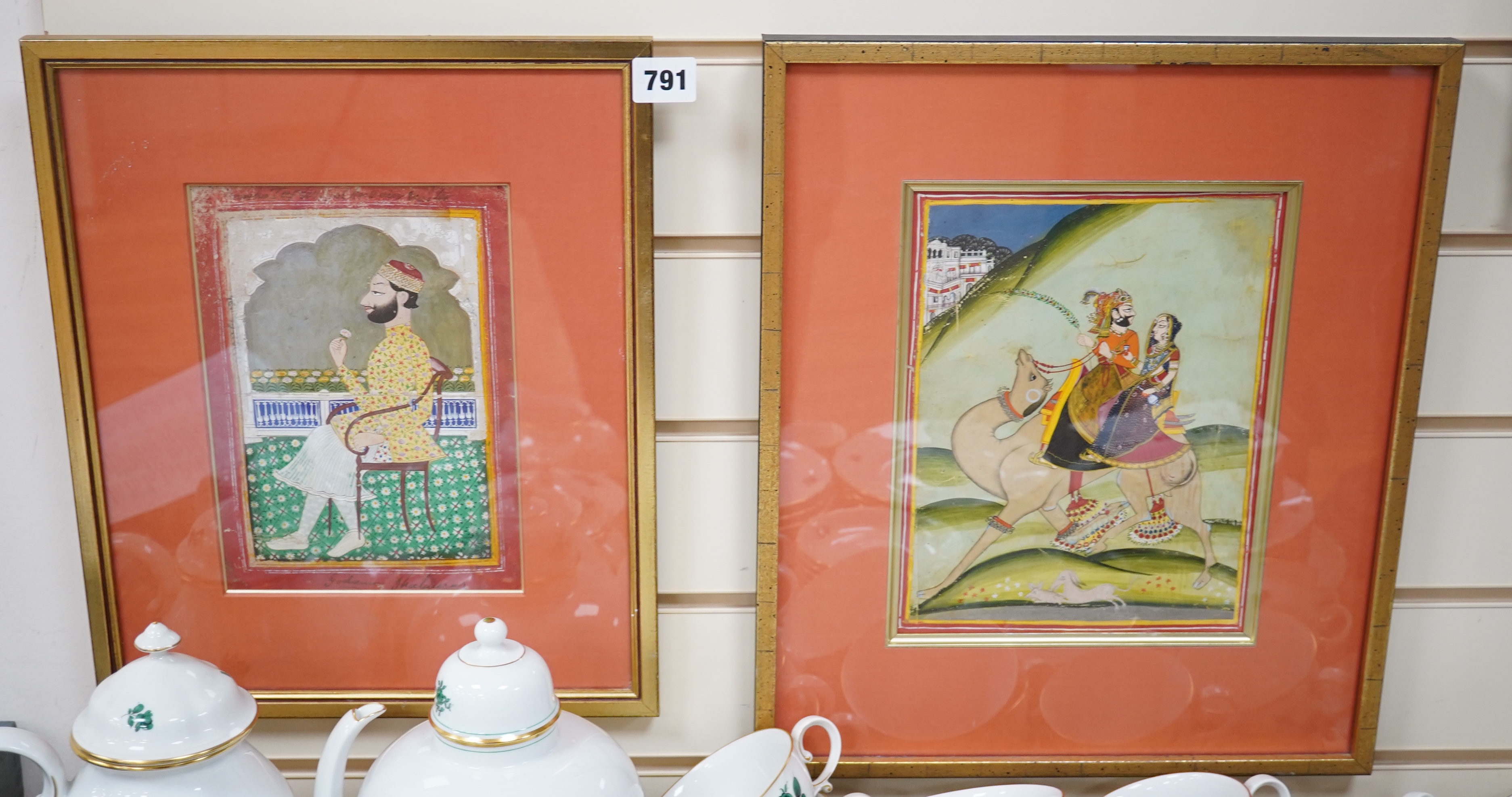 Two 19th century, Indian School gouaches, comprising seated figure and two figures riding a camel, largest 23 x 18cm. Condition - fair